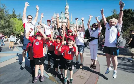  ?? PHOTOS: LYLE ASPINALL ?? Team Pinocchio jumps for a photograph inside Disneyland in Anaheim, Calif., on Wednesday. Dreams Take Fight Calgary took 150 kids deserving a break from difficult situations for a one-day trip to the popular U.S. resort. It was Air Canada’s 24th year...