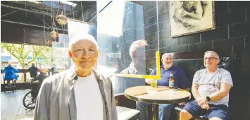  ?? ARLEN REDEKOP / POSTMEDIA ?? Vince Marino, co-owner of the Pumpjack Pub in Vancouver, added hanging Plexiglas dividers between tables so that he could reopen.