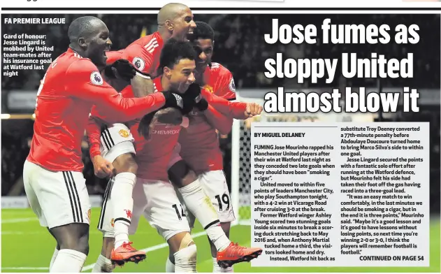  ??  ?? Gard of honour: Jesse Lingard is mobbed by United team-mates after his insurance goal at Watford last night