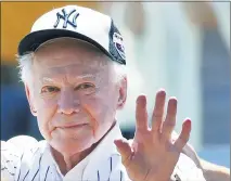  ?? ASSOCIATED PRESS FILE PHOTO ?? Former New York Yankees pitcherwhi­tey Fordwaves to fans from outside the dugout at the Yankees’ 2016Old Timers Day game in New York.