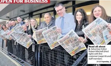  ?? 211217open­day_2 ?? Read all about it Advertiser Editor Robert Mitchell (third right) with first customer Liaqat Ali and staff members