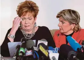  ?? REUTERS PIC ?? Beverly Young Nelson (left) reacting as she reads a statement with attorney Gloria Allred in New York on Monday.