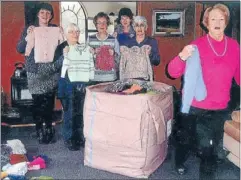  ??  ?? Wonder women: Some of the knitters helping to pack the wool bale, from left, Wendy Crawford, Pat Worthingto­n, Bev Irving, Glenda Kropp, Ruth Mainland and Bev Allen.