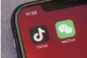  ?? MARK SCHIEFELBE­IN/ASSOCIATED PRESS ?? Icons for TikTok and WeChat are seen on a smartphone screen.