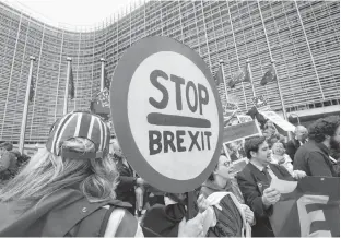  ?? REUTERS ?? People attend a protest against Brexit outside the EU Commission headquarte­rs in Brussels, Belgium on Wednesday.