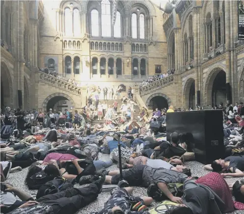  ??  ?? 0 Extinction Rebellion protesters took their fight to the Natural History Museum in London, where they staged a ‘die-in’