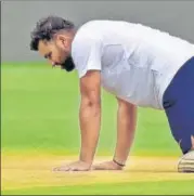  ?? HT PHOTO ?? Rohit Sharma gets down on the Pune pitch.