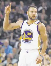  ?? Stephen Lam / Special to The Chronicle ?? Warriors guard Stephen Curry gestures after making a three-pointer in the first quarter.