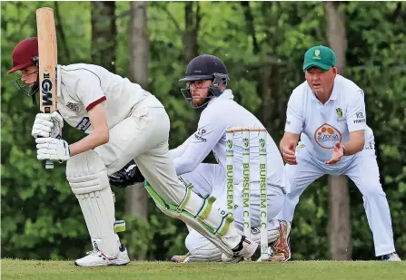  ?? ?? DRIVING FORCE: Little Stoke seconds’ Oliver Main looks for runs in his side’s game against Burslem. Pictures: Pete Stonier