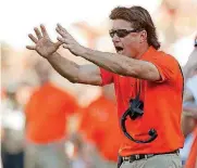  ?? [PHOTO BY BRYAN TERRY, THE OKLAHOMAN] ?? Oklahoma State coach Mike Gundy yells from the sideline during the Cowboys’ 59-16 win over Baylor this season in Stillwater.