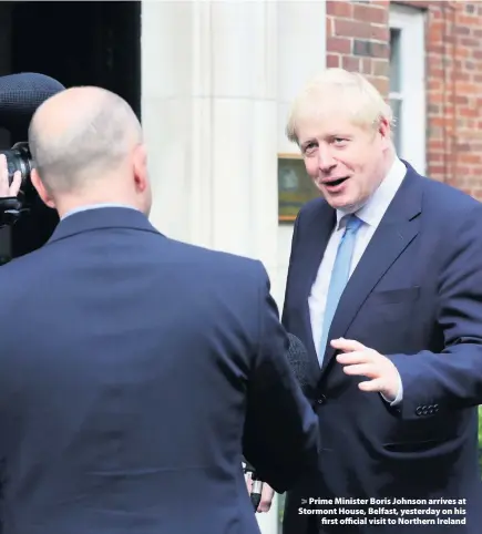  ??  ?? > Prime Minister Boris Johnson arrives at Stormont House, Belfast, yesterday on his first official visit to Northern Ireland
