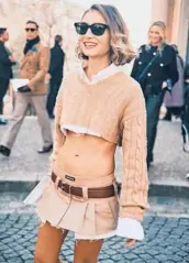  ?? SIMBARASHE CHA/THE NEW YORK TIMES ?? Jenny Walton in a Miu Miu skirt March 15 at the brand’s fall 2022 show in Paris.