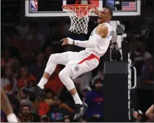  ?? CHRISTIAN PETERSEN — GETTY IMAGES ?? The Clippers' Russell Westbrook throws down a dunk during Tuesday's game against the Suns at Phoenix. Westbrook scored 16points.