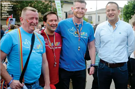  ??  ?? smiles: Mr Varadkar at the start of Belfast’s Pride parade yesterday