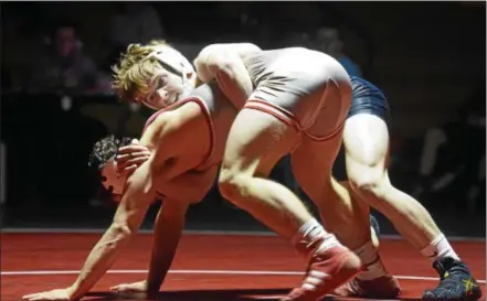  ?? AUSTIN HERTZOG - DIGITAL FIRST MEDIA ?? Boyertown’s Brett Breidor, top, tries to control Owen J. Roberts’ Cole Meredith at 145 Wednesday. Meredith won 4-3.