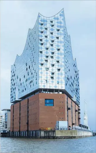  ?? Morris MacMatzen Getty Images ?? HAMBURG’S waterfront concert hall effectivel­y — and powerfully — fuses the old with the new.