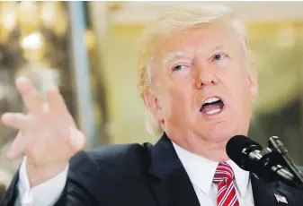  ??  ?? U.S. President Donald Trump speaks to the media in the lobby of Trump Tower in New York on Tuesday.