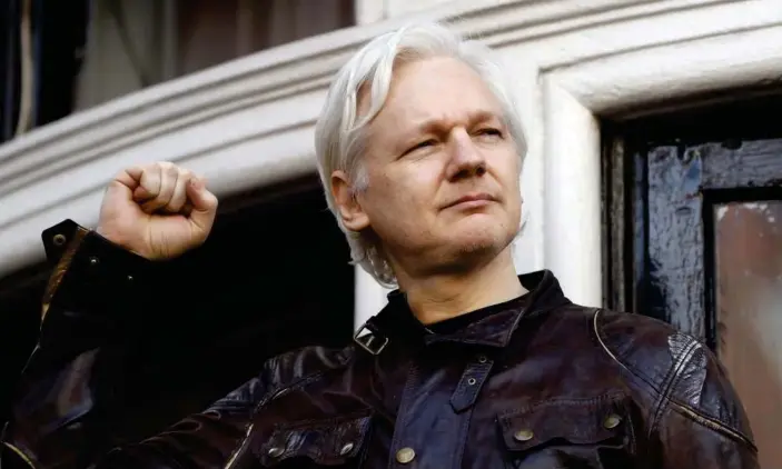  ?? Photograph: Frank Augstein/AP ?? Julian Assange outside the Ecuadorian embassy in London in 2017.