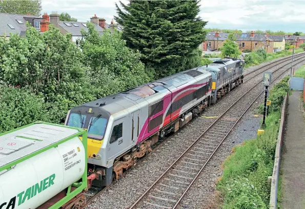  ?? Stephen White ?? No. 084 hauls ‘Enterprise'-liveried No. 228 dead in train past Claude Road, Drumcondra, while working the 10.05 Ballina-Dublin Port IWT service on June 8.