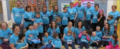  ??  ?? Staff and pupils at the launch of the Blue Run at Scoil Mhuire Coolcotts.