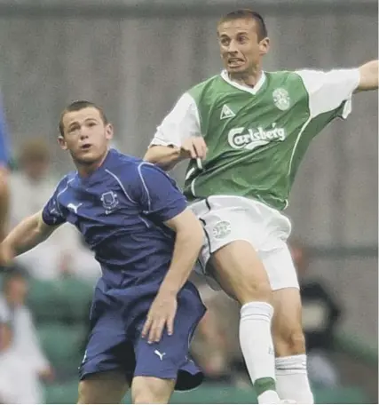  ??  ?? 0 Everton’s Wayne Rooney challenges Gary Smith of Hibs during a pre-season friendly at Easter Road in 2002.