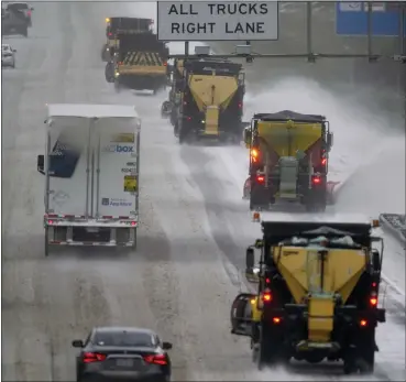  ?? GERRY BROOME — THE ASSOCIATED PRESS ?? Vehicles navigate hazardous driving conditions along Interstate 85/40as a winter storm moves through the area in Mebane, N.C., on Sunday.