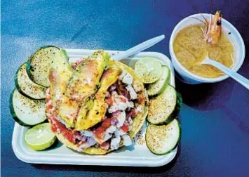  ?? CARLOS RICO U-T PHOTOS ?? The fish tostada at Mariscos Germán in San Marcos. All orders from the 7-year-old food truck come with a compliment­ary small shrimp soup.