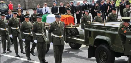  ?? Pic Daragh Mc Sweeney/Provision. ?? Southern Brigade of the Irish Defence Forces escort the ceremonial gun carriage carrying the remains at the funeral service of three-star Private Daniel Donougher at the Church of the Resurrecti­on, Mallow.