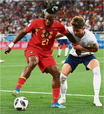  ??  ?? Out of my way: Belgium forward Michy Batshuayi (left) vying for the ball with England defender Gary Cahill during the Group G match at the Kaliningra­d Stadium on Thursday. — AFP