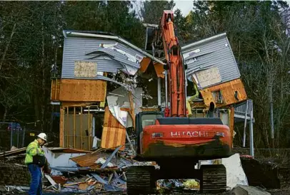  ?? TED S. WARREN/ASSOCIATED PRESS ?? Workers demolished the house where four University of Idaho students were killed in 2022.