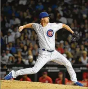  ?? GETTY IMAGES ?? Alec Mills combined with four others to hold the Reds scoreless Monday after an ineffectiv­e start by Cole Hamels. The Cubs won 8-2 in their first game without injured first baseman Anthony Rizzo. By Jay Cohen