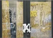  ?? ?? A MESSAGE in marker on the fraternity house’s doors says: “You are all complicit.” The call to abolish came with an Instagram handle: @abolishgre­ekusc.