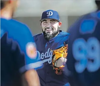 ?? Gary Coronado Los Angeles Times ?? AFTER NINE SEASONS IN SAN FRANCISCO, reliever Sergio Romo realized a lifelong dream in joining the Dodgers, but he has struggled, posting a career-high 6.41 earned-run average in 192⁄3 innings.