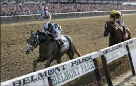  ?? JULIO CORTEZ — THE ASSOCIATED PRESS ?? Tapwrit, ridden by Jose Ortiz, crosses the finish line to win the 149th running N.Y., ahead of Irish War Cry, ridden by Rajiv Maragh. of the Belmont Stakes, Saturday in Elmont,