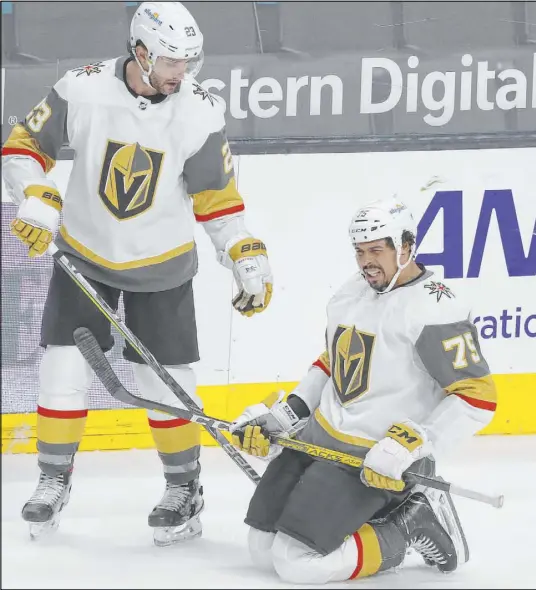  ?? Josie Lepe The Associated Press ?? Defenseman Alec Martinez, left, checks on right wing Ryan Reaves, who left in the third after taking a skate to the lower body.