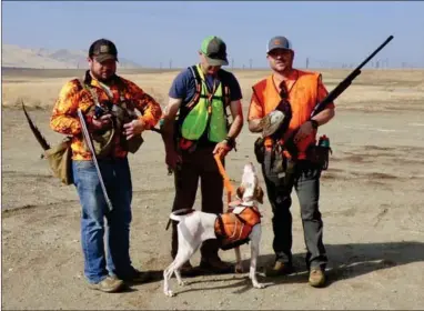  ?? RECORDER PHOTO BY JAMIE A. HUNT ?? Chris Peichoto, Kevin Vieira with his dog, and Corey Tucker during Rolling For Ringnecks Veterans Pheasant Hunt sponsored by STCSA on Friday, November 18. Peichoto possibly won the contest for the pheasant with the longest tail feathers.