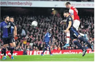  ??  ?? HE’S BACK: Arsenal’s Rob Holding scores on return from injury in midweek Carabao Cup win
