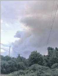  ?? THE CANADIAN PRESS/HO, JAMES PALMER ?? Smoke from a nearby forest fire is seen at the Hartley Bay marina in Alban, Ont. near the French River Provincial Park in this undated handout photo. Crews are continuing to battle dozens of forest fires in northeaste­rn Ontario, after the biggest of...