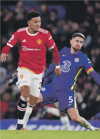  ?? PA ?? Jadon Sancho, left, opened the scoring for United only for Jorginho, right, to level from the spot to earn Chelsea a point at Stamford Bridge yesterday