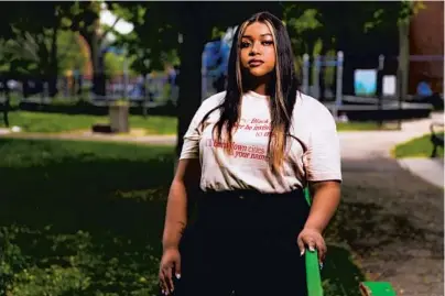  ?? JOSE M. OSORIO/CHICAGO TRIBUNE ?? Activist Eva Maria Lewis stands in Hyde Park in Chicago on Wednesday.