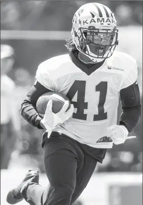  ?? Associated Press ?? Kamara impressing: In this Thursday, May 25, 2017 file photo, New Orleans Saints running back Alvin Kamara (41) carries the ball during a practice in Metairie, La. Why the rookie running back never emerged as a premier college player at Alabama or...