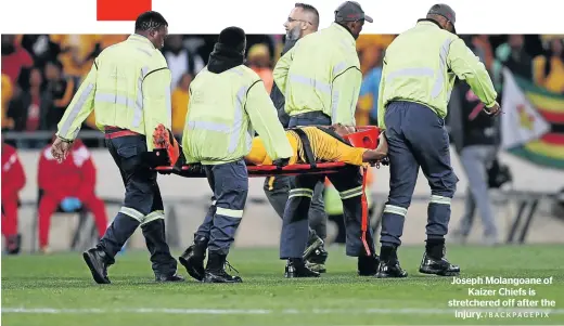  ?? /BACKPAGEPI­X ?? Joseph Molangoane of Kaizer Chiefs is stretchere­d off after the injury.