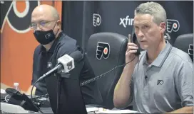  ?? SUBMITTED PHOTO – ZACK HILL ?? Flyers general manager Chuck Fletcher, right, here working the phones during the NHL Draft last weekend with assistant GM Brent Flahr, stayed relaxed through the start of the NHL free agency period.