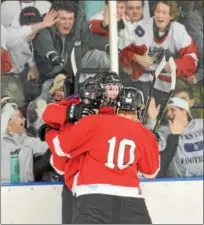  ?? SAM STEWART - DIGITAL FIRST MEDIA ?? Owen J. Roberts’ Johnny Kettelle is congratula­ted by teammates and fans after scoring a goal in the second period against Boyertown Friday night.