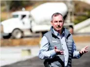  ?? ?? Eugene Naughton, president of the Dollywood Company, speaks to the media at the new parking toll booth area.