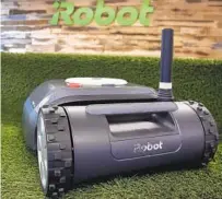  ?? ELISE AMENDOLA AP FILE ?? IRobot, which makes this Terra lawn mower in addition to its self-driving vacuums, sells robots worldwide.