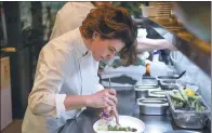  ?? OZAN KOSE / AGENCE FRANCE-PRESSE ?? Aylin Yazicioglu, executive chef of the Nicole restaurant in Istanbul, says perception­s about Turkish cuisine are changing slowly.