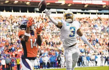  ?? Jack Dempsey Associated Press ?? CHARGERS safety Derwin James Jr. breaks up a pass intended for Denver’s Courtland Sutton. James later was pulled from the game; he was OK, but fellow starters Mike Williams and Kenneth Murray Jr. got hurt.