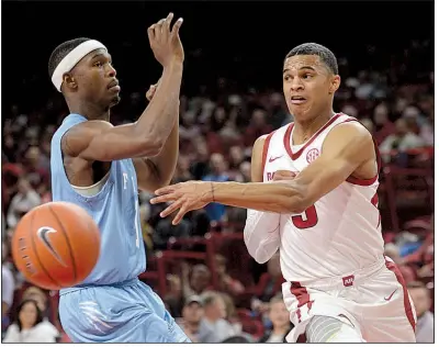  ?? NWA Democrat-Gazette/ANDY SHUPE ?? Arkansas sophomore point guard Jalen Harris (right) is among the nation’s leaders in assist-to-turnover ratio. “He has got pretty good vision and he’s really clever with his passes and he’s taking pride in it,” Razorbacks Coach Mike Anderson said.