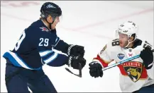  ?? Associated Press photo ?? Patrik Laine of Winnipeg Jets and Mike Hoffman of Florida Panthers during the NHL Global Series Challenge ice hockey match Friday in Helsinki, Finland.